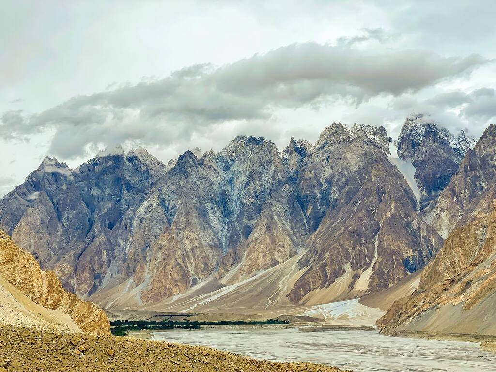 Passu Cones at 20,033 feet high was truly magical.  karakoram highway.  pakistan. 

p.s.  we have been keeping watch with the flooding situation.  due to a landslide that blocked the only road to minapin.  we had to return back to our first hotel in hunz… instagr.am/p/Ch2nPg0prXm/