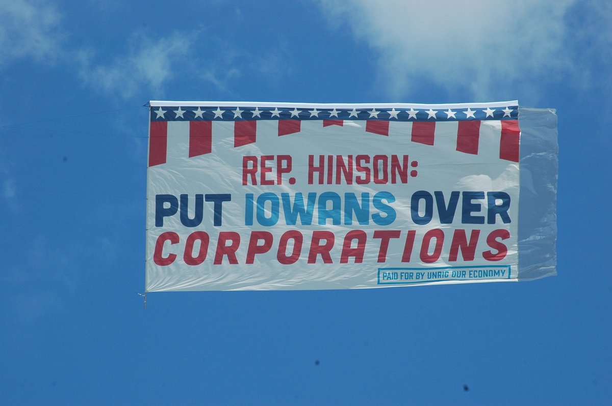 UnrigOurEconomy's tweet photo. Rep. Hinson was a no-show at our town hall last week.

So Unrig Our Economy Iowa flew a banner and drove a mobile billboard by her BBQ to hold her accountable for her votes siding with corporations over her constituents— including her vote against the Inflation Reduction Act. https://t.co/4EqRzNbOOn