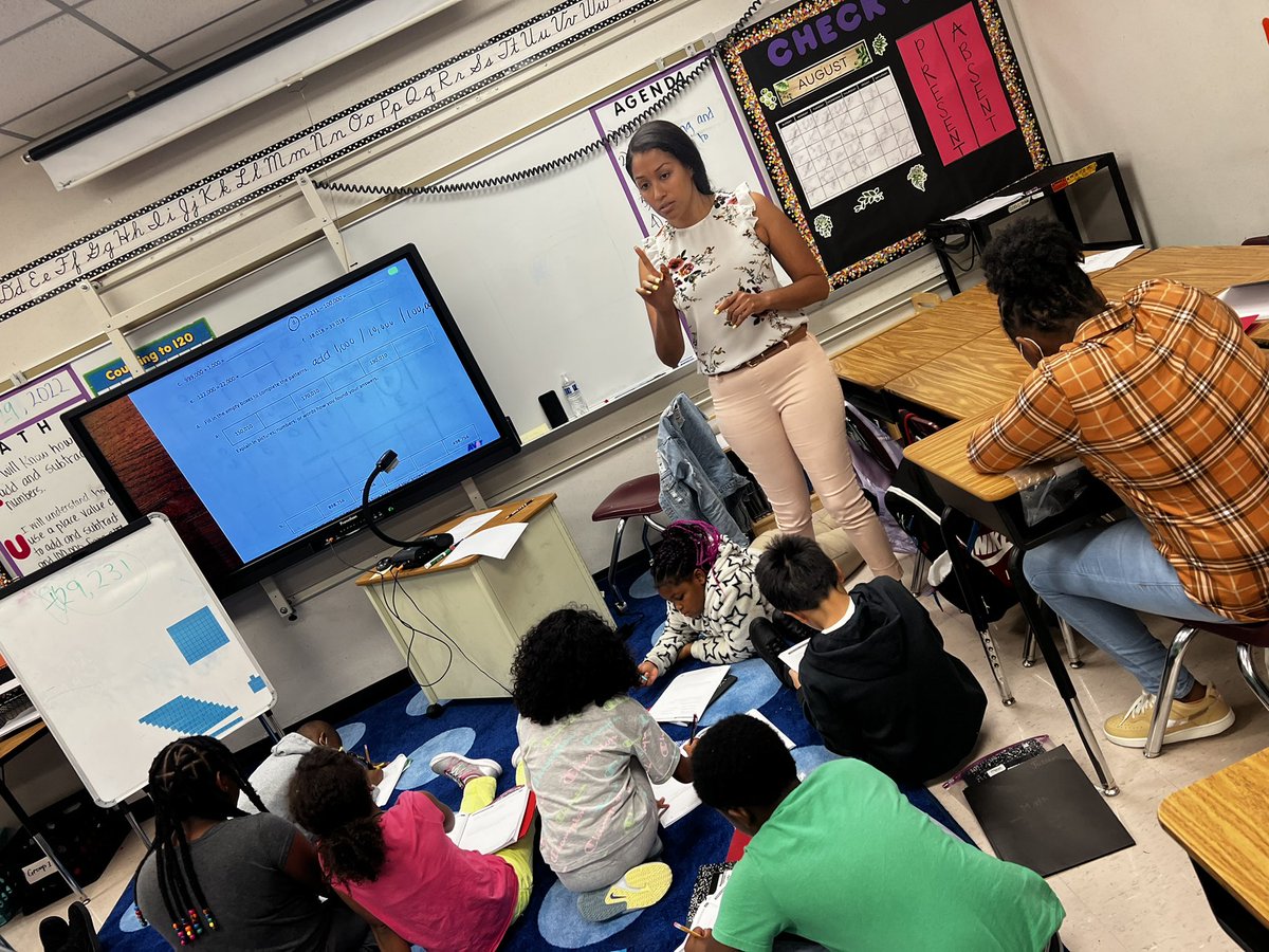 DrWynneLaToya's tweet photo. Ms. Lavergne is always up on her feet teaching &amp; engaging with students. Most students were able to clearly explain the pattern and the place value that was being adjusted in the number pattern. I love how students are accountable in learning with swift teacher feedback! Let’s GO https://t.co/KNxml6VQnc