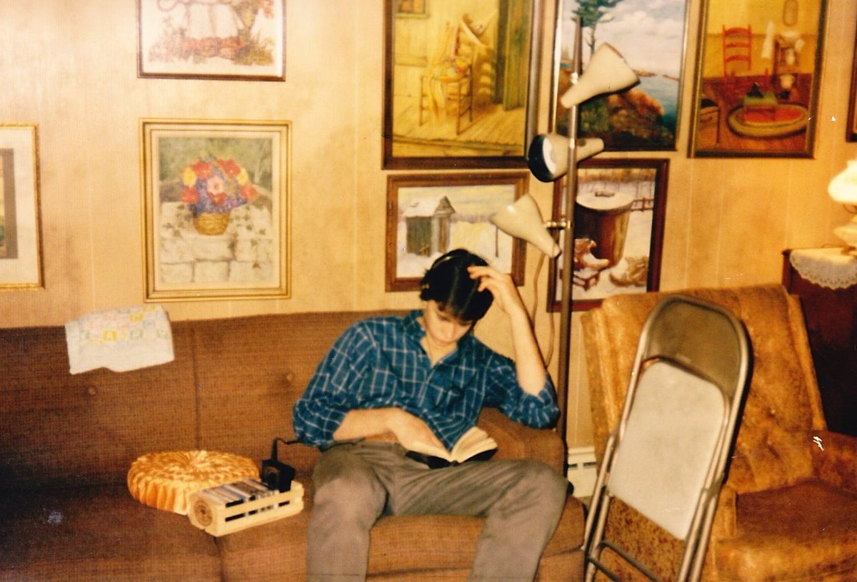Me in the '80s hiding in my great-grandma's basement (her art is on the walls) from a Thanksgiving gathering upstairs, listening to my wooden box of Billy Squier tapes on my Walkman, re-reading <a href="/StephenKing/">Stephen King</a>'s novel THE STAND. 
Who wants to go back? I'll race ya.