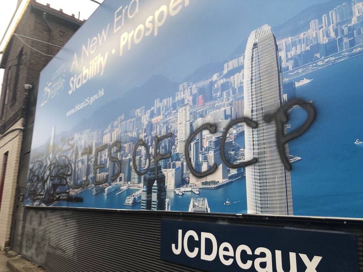 DrewPavlou's tweet photo. Breaking news - Hong Konger freedom fighters have painted over Sydney CCP propaganda billboards glorifying police rule in Hong Kong. There are a total of 14 Hong Kong government billboards across Sydney and Melbourne and they pledge to paint them all https://t.co/LeOPiOZnUx