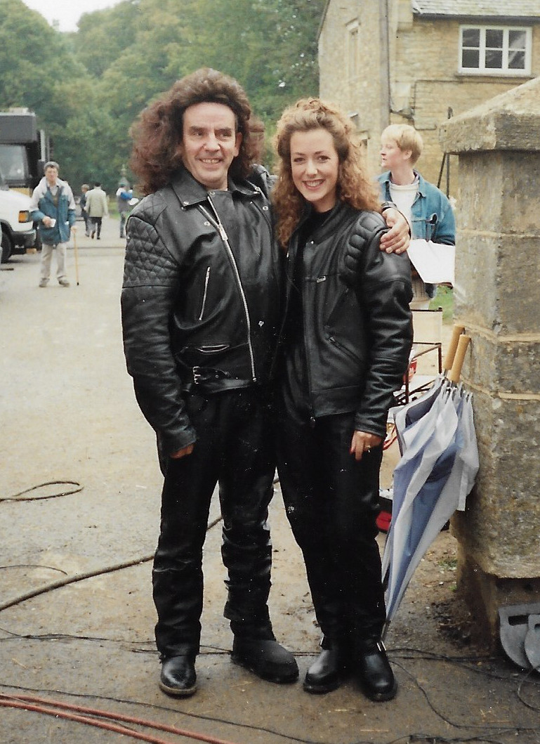 DoesSuitMadame's tweet image. Twins?👯‍♀️@MsJoanneHeywood and stuntman Roy Alon as Miss Lovelock for the motorbike scene from the Sept 1991 filming of S1:E3 of  #AreYouBeingServedAgain/ #GraceAndFavour. Thanks Joanne for the photo! #AYBS #AreYouBeingServed #ThatDoesSuitMadame #podcast #LGBT #BBC #JoanneHeywood