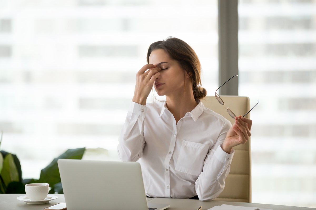 'Being exposed to bright light or glare' can cause eyestrain headaches says the Mayo Clinic. So concentrating on a 'glarey' computer screen is not recommended. Instead of lowering the blinds, reduce glare by installing window film on the office windows.
