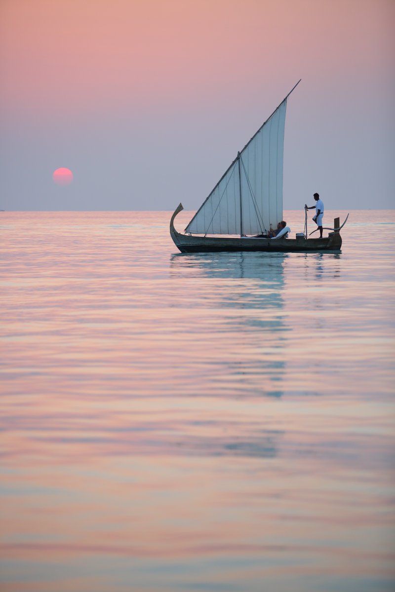 LinaraTravel's tweet photo. Experience the beauty of the Maldives onboard a traditional dhoni and view the sunset from the water.📍 @GiliLankanfushi https://t.co/F2qp6bC2CM