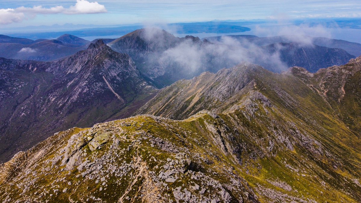 PeterRibbeck's tweet photo. The peaks of Arran yesterday with the Paps of Jura in the distance. #Goatfell #NorthGoatfell #Thesaddle #CirMhór #VisitScotland #Papsofjura @VisitScotland https://t.co/Cg4lYSEmHS