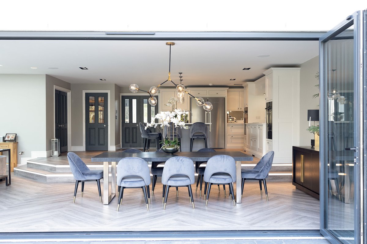 Multi-level areas help to define the different sections of an open plan home. Designing a kitchen that complements the rest of your home is part of the vision.