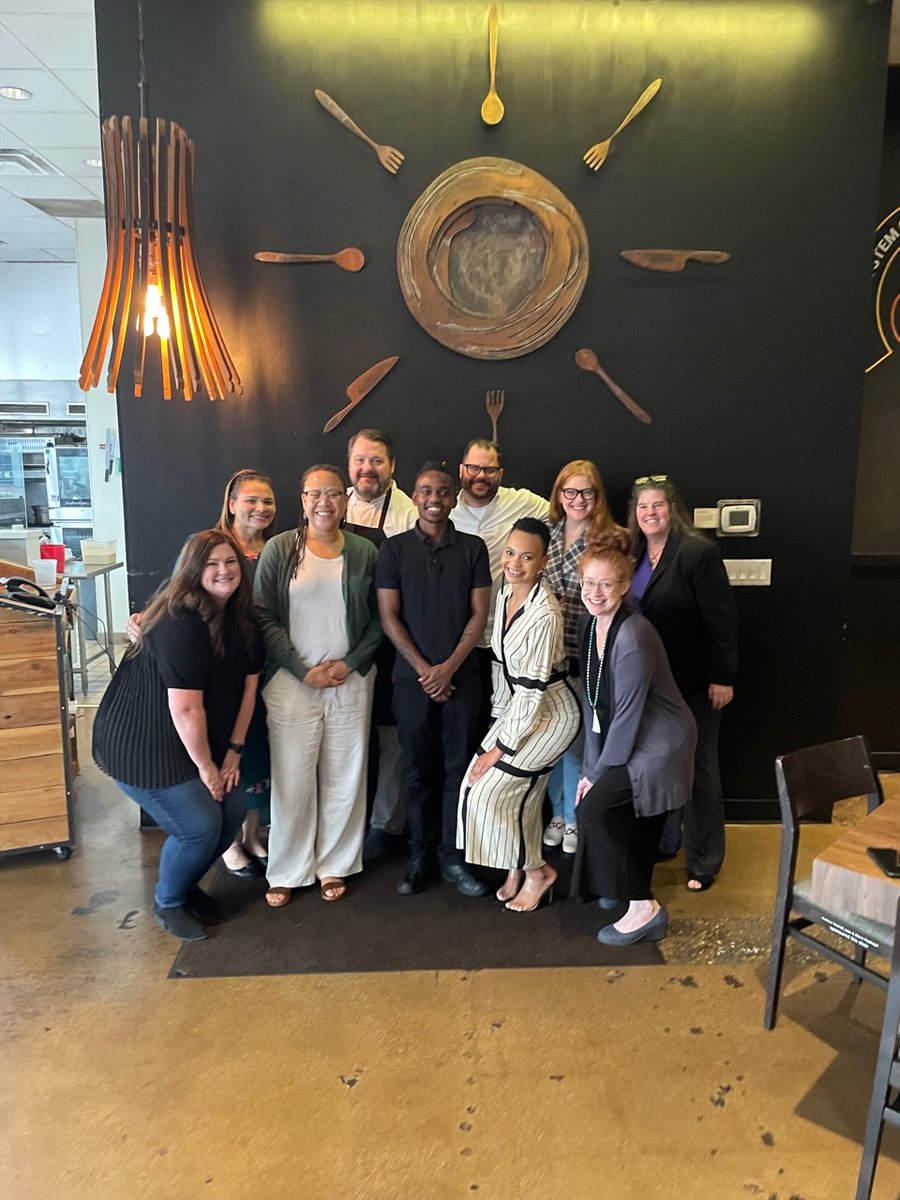 OJJDP Administrator Liz Ryan, pictured with CEO and Exec. Chef Chad Houser and his team, toured <a href="/cafemomentum/">Café Momentum</a> in Dallas, TX, a nonprofit restaurant that provides a 12-month paid internship program for justice-involved youth.