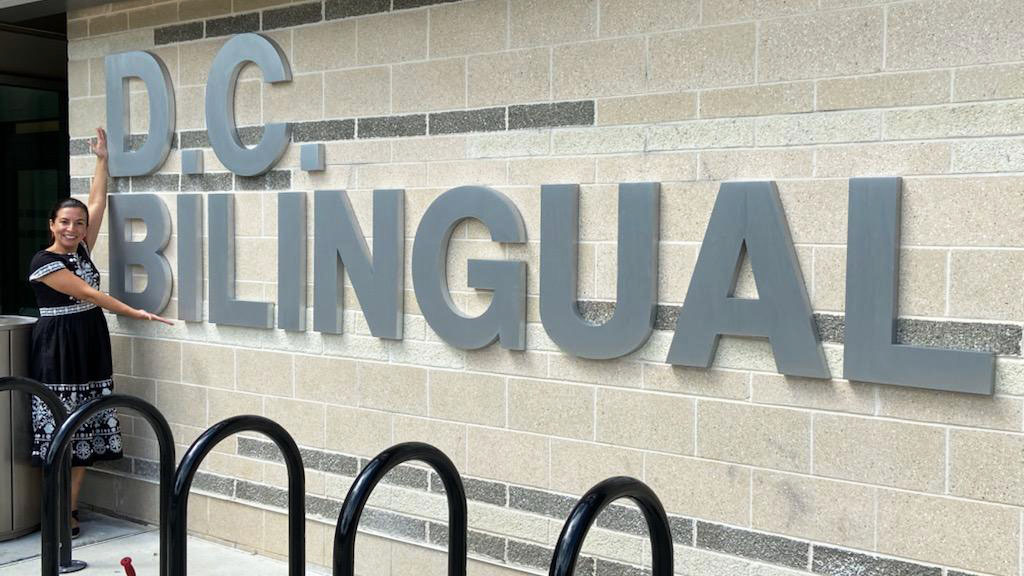 Head of School Daniela Anello is excited to show off the beautiful new sign outside the rear reception entrance 😍