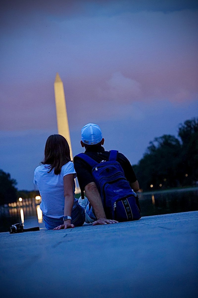 KrisFreemanPA's tweet photo. I was capturing pics on Aug 21st in #WashingtonDC and waiting out the storm for that famous monument reflection. Camera was ground level and timed, this pair (maybe dad and daughter?) sat down and I captured this. I never got to show them or meet them. #photography https://t.co/DXGX62f0HL