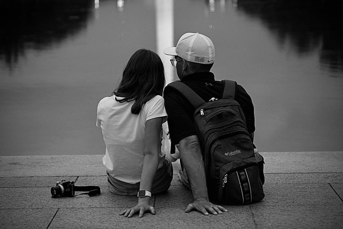 KrisFreemanPA's tweet photo. I was capturing pics on Aug 21st in #WashingtonDC and waiting out the storm for that famous monument reflection. Camera was ground level and timed, this pair (maybe dad and daughter?) sat down and I captured this. I never got to show them or meet them. #photography https://t.co/DXGX62f0HL
