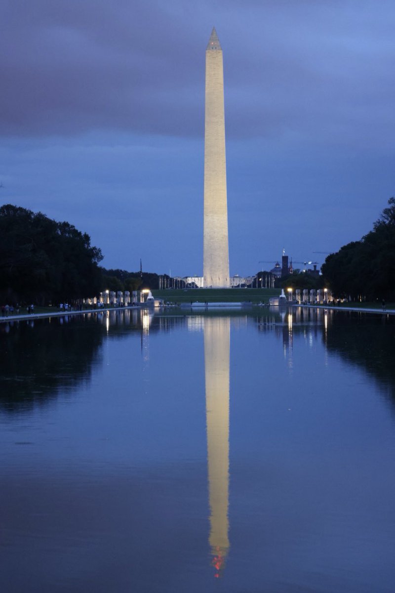 KrisFreemanPA's tweet photo. I was capturing pics on Aug 21st in #WashingtonDC and waiting out the storm for that famous monument reflection. Camera was ground level and timed, this pair (maybe dad and daughter?) sat down and I captured this. I never got to show them or meet them. #photography https://t.co/DXGX62f0HL