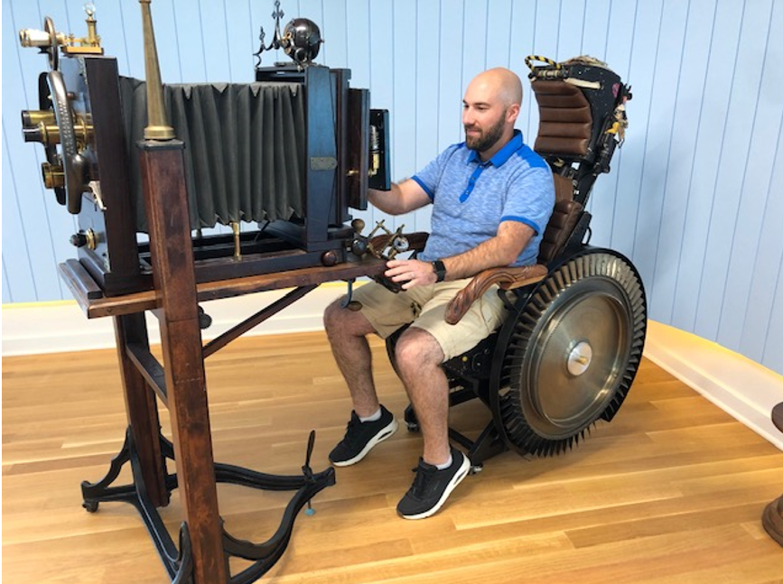 ForeFrontCorp's tweet photo. When you’re at our HQ, take a video call on The Original Zoom Machine! Inspired by Edison’s Telephonoscope, based on an idea by our Michel Berger and built by Modvic (https://t.co/bPEt7aW4Eb), The OZM combines a fighter jet seat, vintage camera, lenses &amp; gauges, and a touchscreen https://t.co/meLBoeMpoX