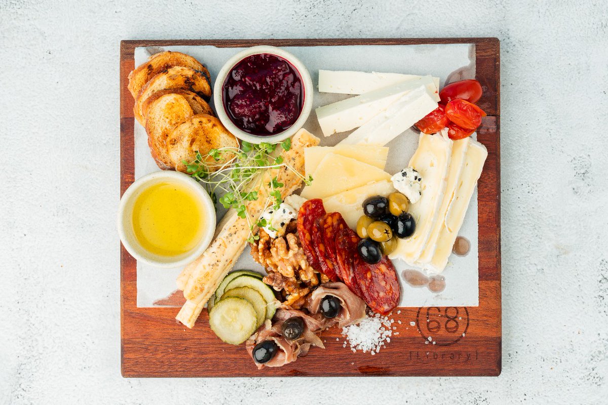 Indulge in our Cheese Boards featuring a selection of our Finest Cheeses, Cold Cuts &amp; Condiments ranging from Pickled Vegetables to Natural Spreads &amp; Marmalades, served with Toasted Bread &amp; EVOO at Library68. For wine pairing check out our new wine list on bit.ly/3Tu5jHO