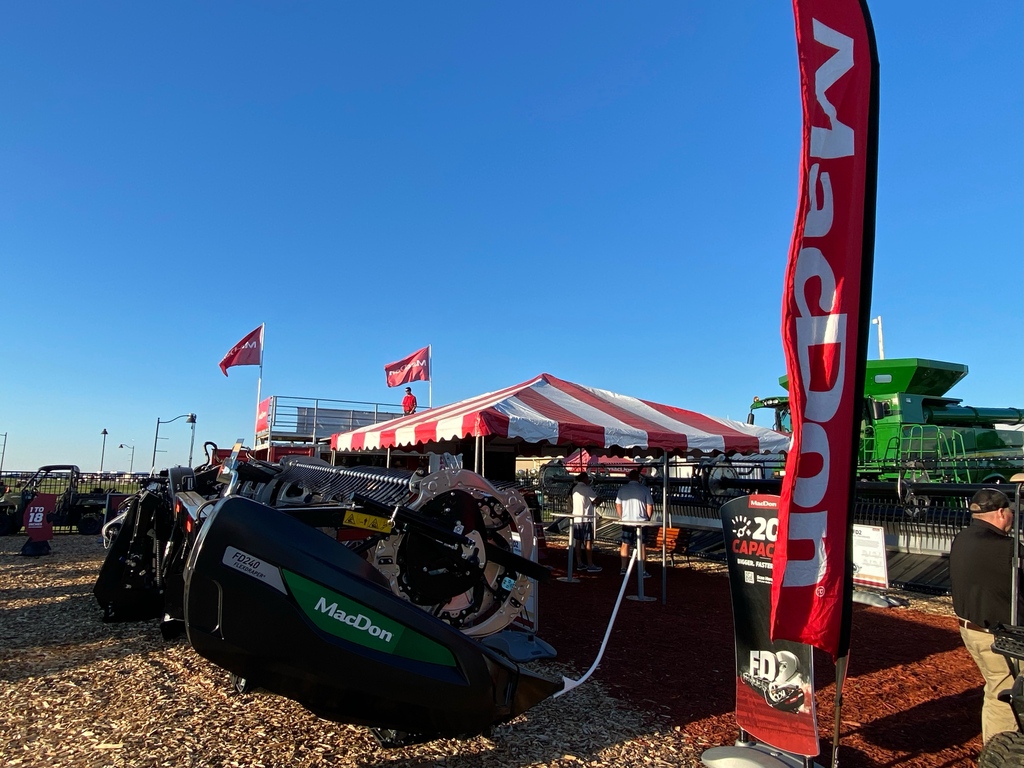 MacDon's tweet photo. Set up and ready for Day 1 of this year's @FPShow in Boone, IA. We've got plenty to see including the all-new FD2 FlexDraper, C Series Corn Header, M1 Windrowers, R1 Pull- Type, R2 Disc Mower, and more! Find us today until Thursday at lot number 21S. #FPS22 https://t.co/ZYa4SMq5Ox