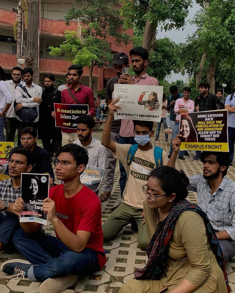 JsfJamia's tweet photo. Students of @jmiu_official gathered at Central canteen premisesin solidarity with MPhil-Phd Scholar Safoora Zargar. Students from Various faculty Centre collectively agitated against the varsity administration regarding Cancellation her admission. 
#SafooraZargar https://t.co/54d5pHFKFm