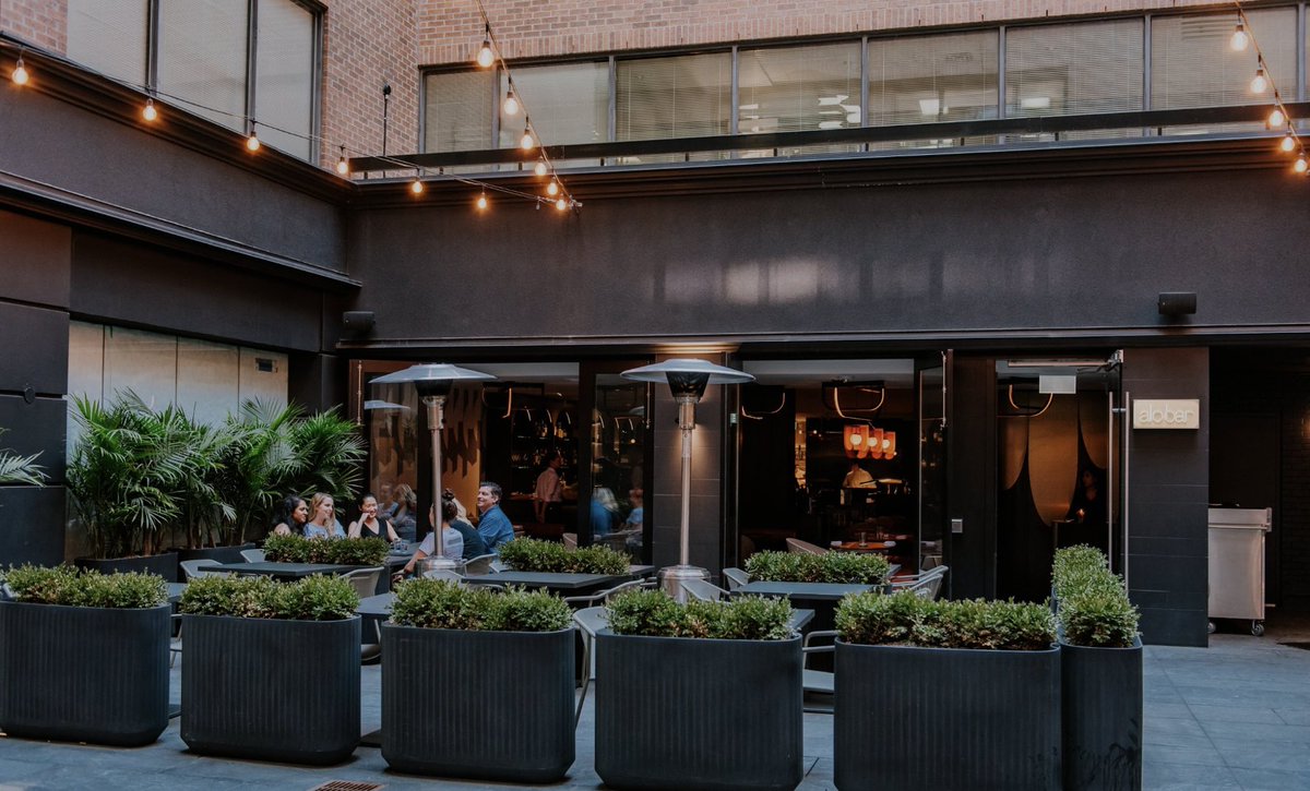 Tucked across the lane from B Hemmings & Co., you'll spot #AloBar  Yorkville's distinct fairy-lights and large terrace lined with lush  greenery, featuring choice raw items with fine accoutrements, fish and chops
