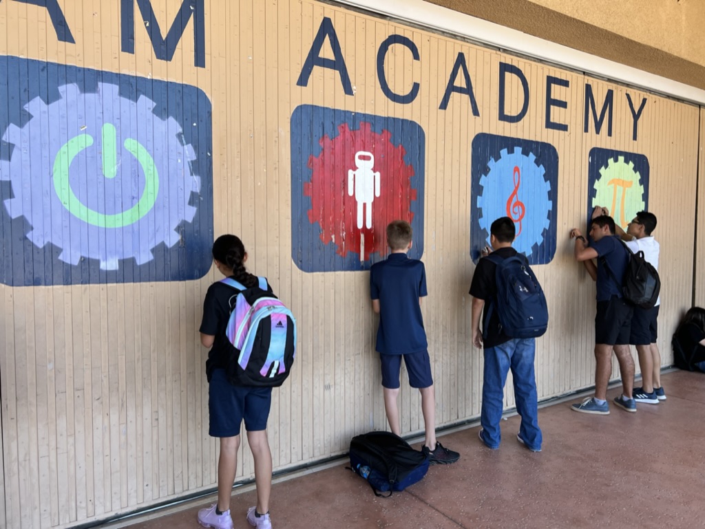 STEAMpride's tweet photo. Students are showing off their STEAM PRIDE by volunteering for campus beautification.  We're removing thousands of staples from our STEAM wall to get ready for a new coat of paint. https://t.co/65Vhrgp2dg
