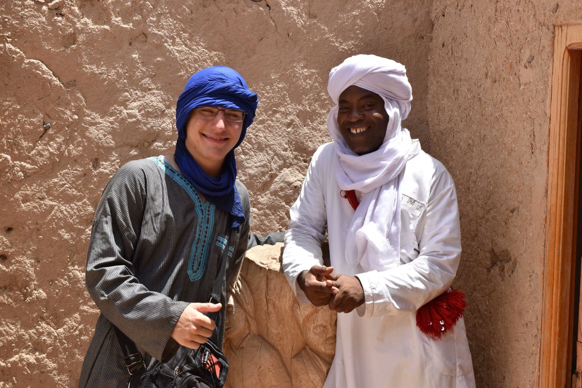 CLSscholarship's tweet photo. #CLSArabic scholar Matthew strikes up a conversation with a local Gnawa musician about the Sufi genre of music. Gnawa music refers to Moroccan and West African Islamic songs and rhythms. The two got to connect over their interests in these musical genres. @ECAatState #CLS22 πΌ https://t.co/y4HyXoyRO7
