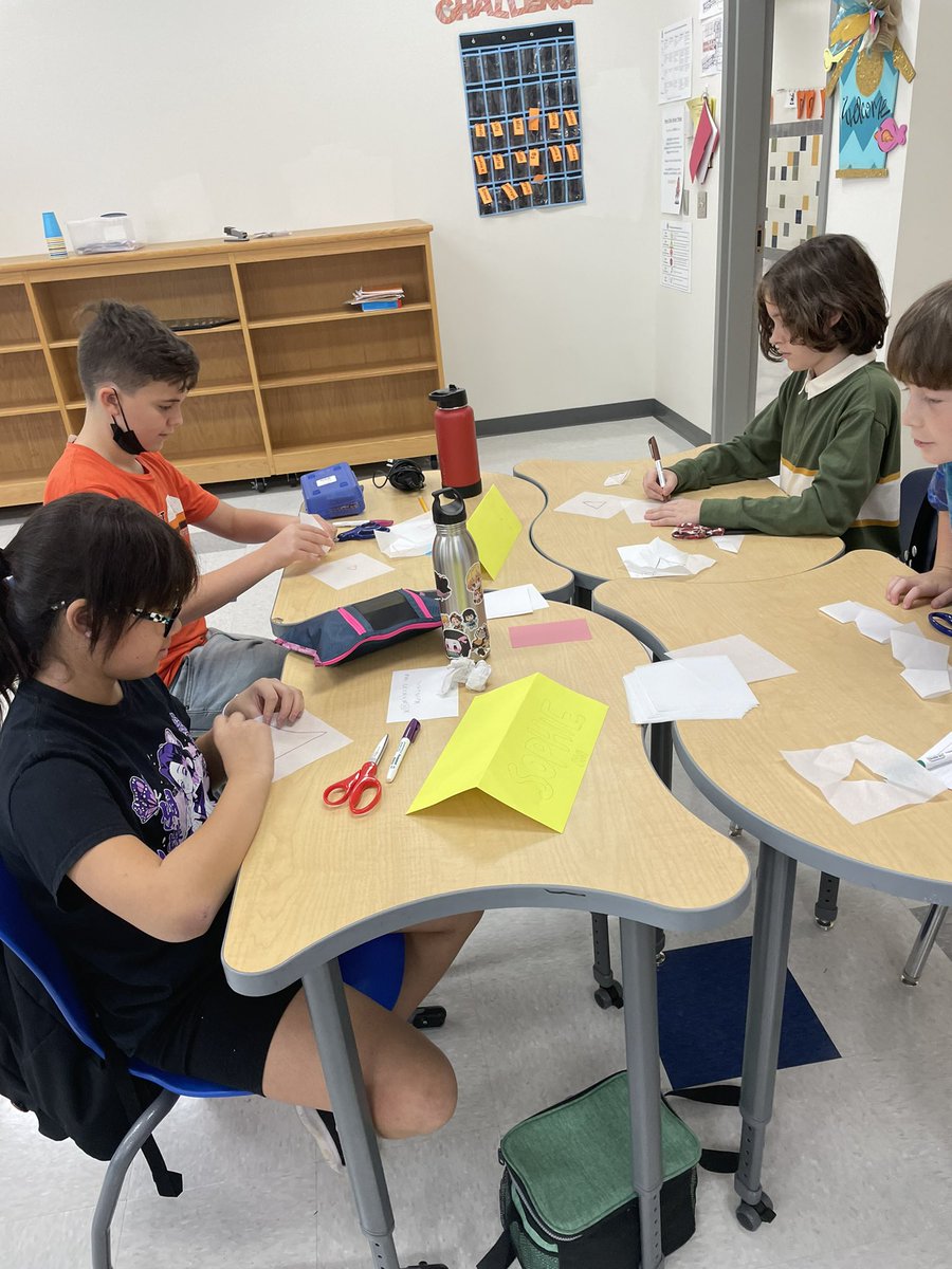 AmyPreston2021's tweet photo. 6th and 7th grade students trying to make various shapes using one cut! Mastered the triangle! #woim #youcubed #joboaler @ROSArockets https://t.co/TnlfAeFyuI