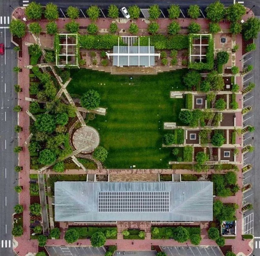Five hundred feet underneath Guthrie Green lies a geo-exchange system consisting of 120 wells that circulate water to transfer heat up in the winter and down in the summer. This process generates 600 tons of heating and cooling for 6 surrounding nonprofits!