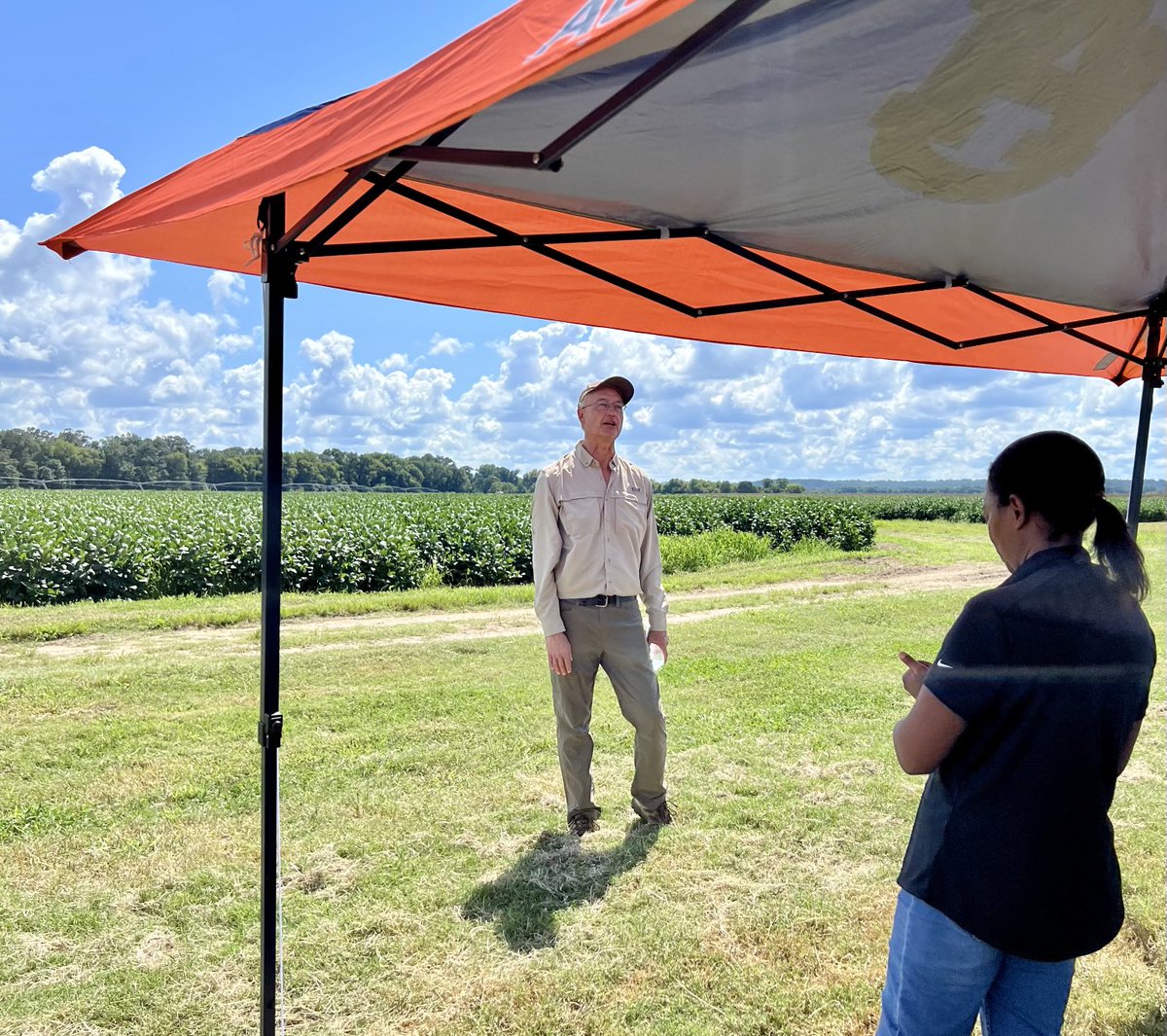 alabamaED's tweet photo. Expounding on the horrors of soybean rust at a local field day.  For a relatively tall man my shadow takes up a minimum of space.  #APS #ACES #Cropprotectionnetwork https://t.co/RzgzXFfPGh