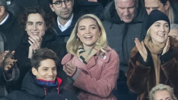 pughposts's tweet photo. florence pugh, timothée chalamet and saoirse ronan at a football match, WHAT A MOMENT https://t.co/IIFwbqPFep