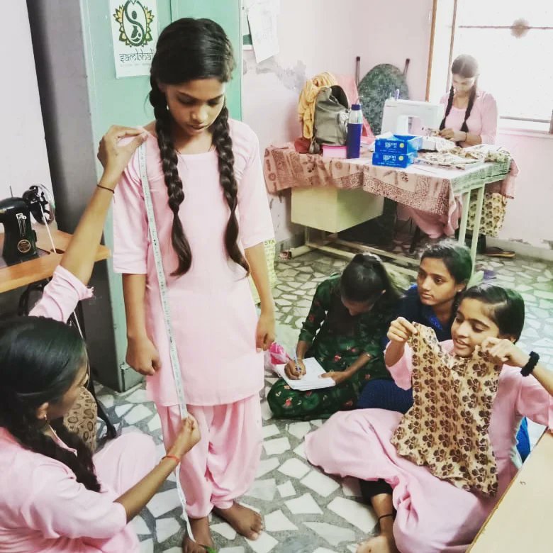 SambhaliTrust's tweet photo. People ask us what do we do with the clothes that women learn to make? 
You will be happy to know that these clothes are given to them as a souvenir, something they cherish, they own which is self-made. 
#sambhalitrust #vocationaleducation #vocationaltraining #skilldevelopment https://t.co/4eJVuSzzyW