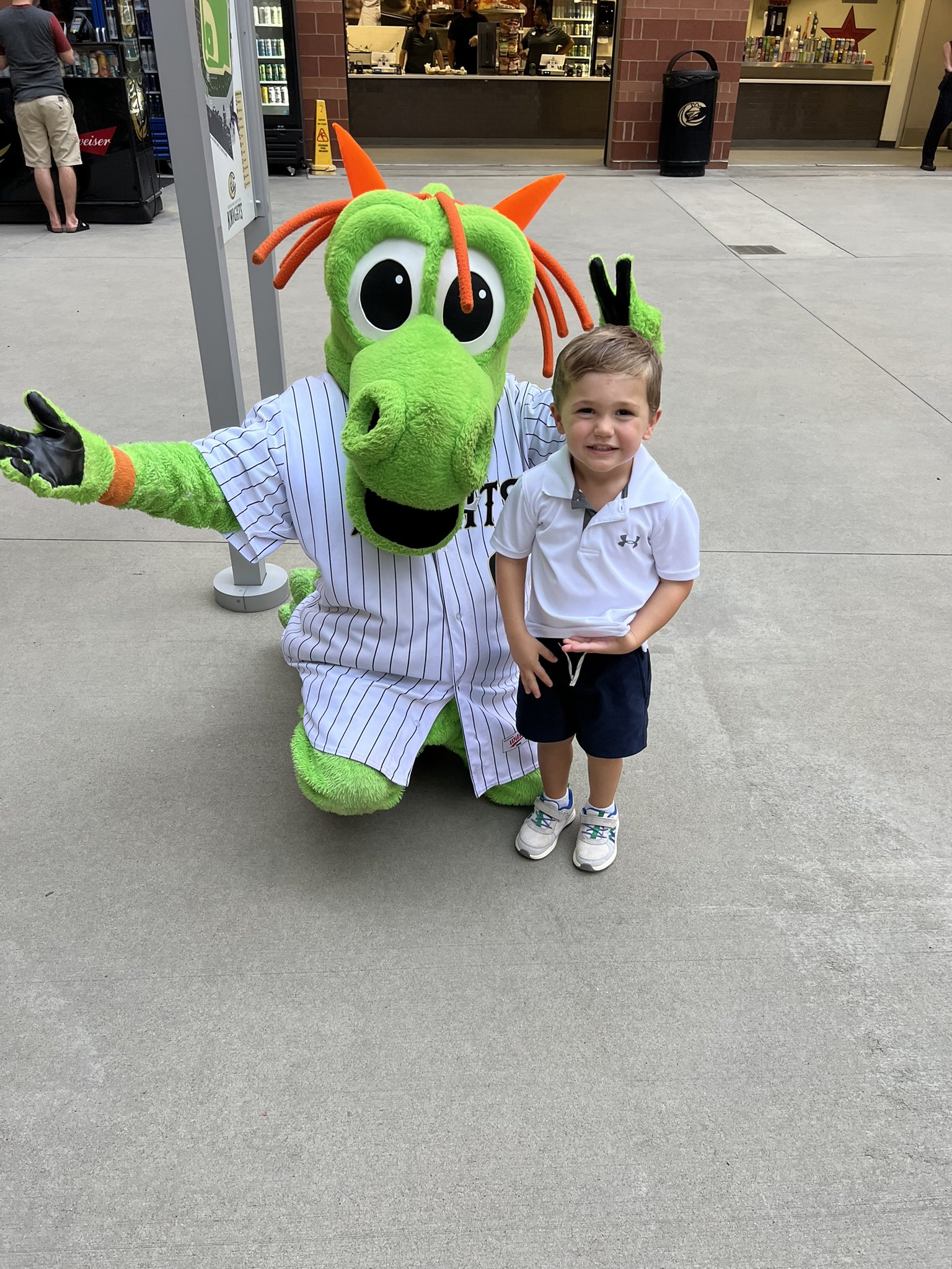 Charlotte Knights mascot Homer the Dragon leads the fans in cheers during  an International League game against the Memphis Redbirds at Truist Field  on April 2, 2023 in Charlotte, North Carolina. (Brian