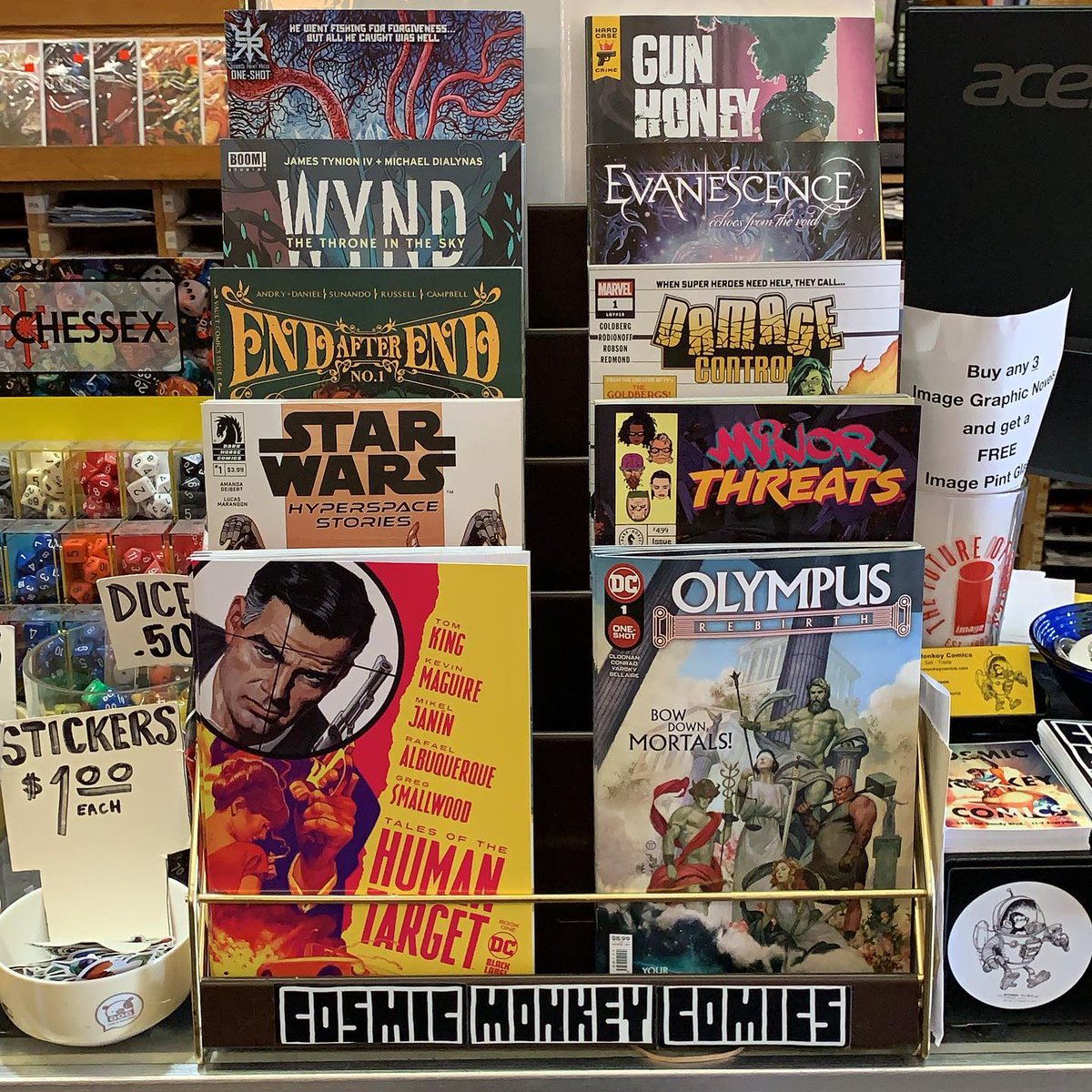 Here’s our featured rack! #talesofthehumantarget #olympusrebirth #starwarshyperspacestories #minorthreats #endafterend #damagecontrol #wyndthethroneinthesky #evanescenceechoesfromthewind #kold #gunhoneybloodforblood #ncbd #comics #cosmicmonkeycomics