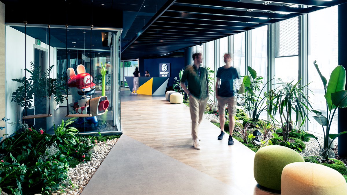 UbisoftMilan's tweet photo. We can finally announce our new, shiny office! 🥳 We needed a place to accommodate our future as a studio and it is now fully operational. The reception is in the middle of a lush green entrance, that leads to two open spaces for the team 👇 ... https://t.co/4iaxvqW3R2