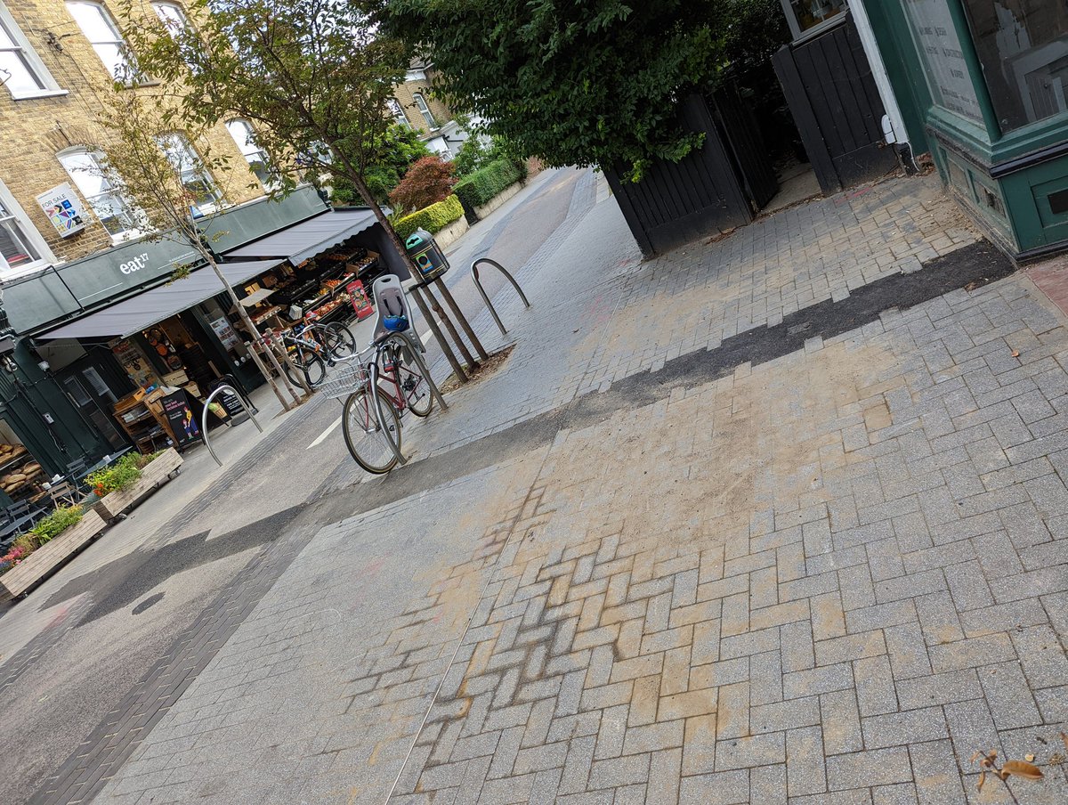 Hi <a href="/wfcouncil/">Waltham Forest Council</a> why was this repair job allowed to happen in this way on Orford Road? It's a brick paved street that someone has now put a stripe of tarmac across. How does this fit with the requirements of being a conservation area? #walthamstowvillage