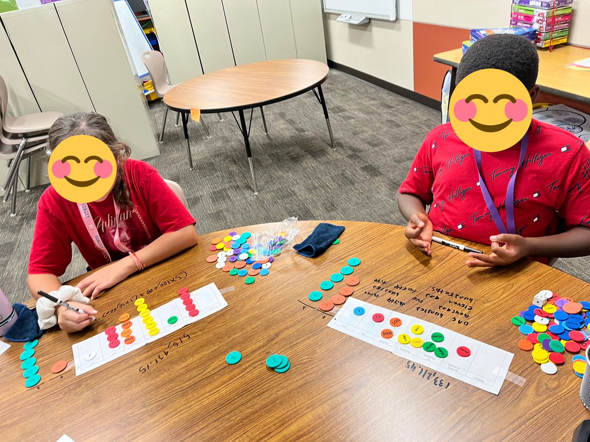 Fifth graders working hard on place value.