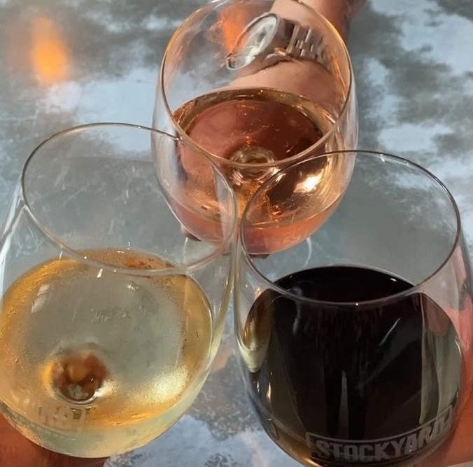 StockyardBurger's tweet photo. All the feels of Uncorked Wednesday - Cheers to half-priced bottles of wine!  
#StockyardBurgersandBones #wine #redwhiteandblush #humpday #Wednesday #cheers https://t.co/K171HuXVWw