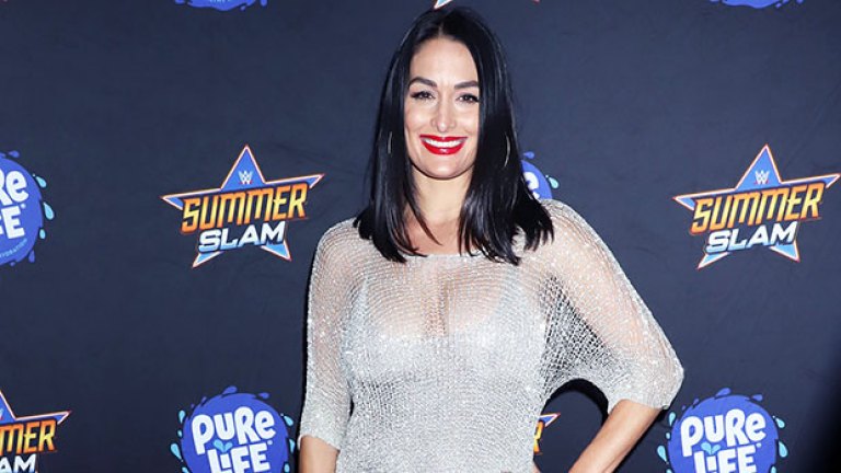 Nikki Bella slays in a white crop top, skirt and 