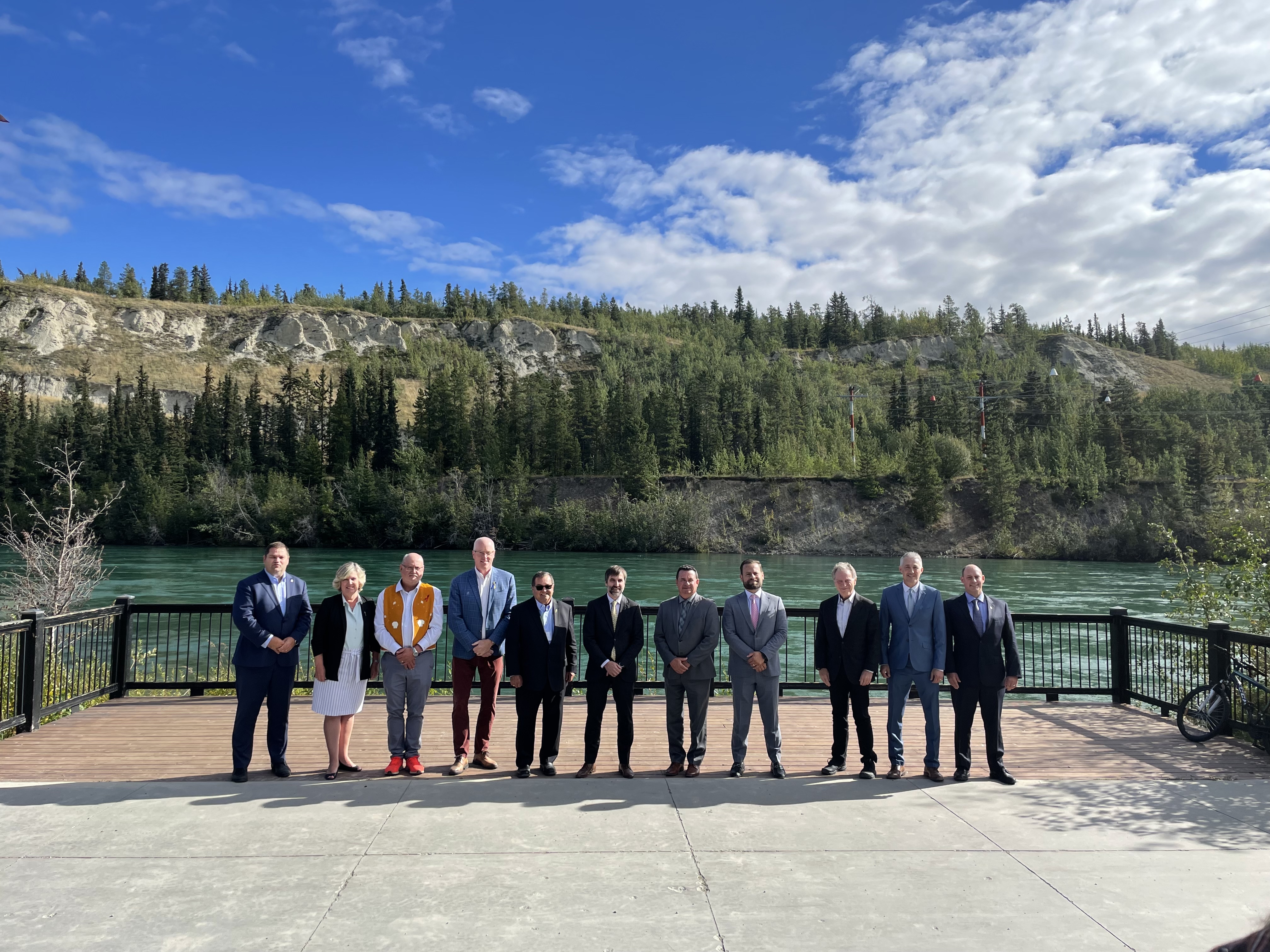 Canadian Council of Ministers of the Environment group photo, mountains and water in the background 