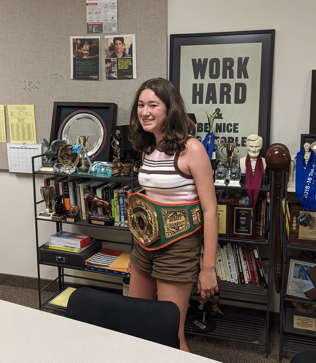 hwdebate's tweet photo. Novice debater wearing the Meadows championship belt from the year she was born. https://t.co/cXJHWGi0GE