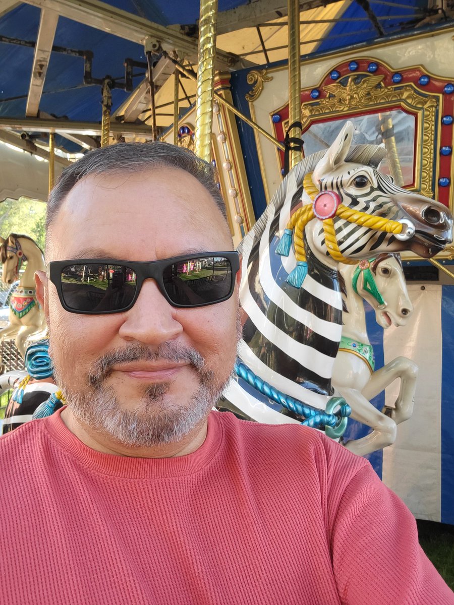 FriendsofInyo's tweet photo. #FriendsoftheInyo 's Lou Medina is getting into the Fair spirit at the #TriCountyFair by taking a selfie with his favorite African animal, the zebra, at the merry-go-round. The Fair starts Thurs, Sept 1, and ends Sun, Sept 4. We'll be at the Floriculture building. CU@ the Fair! https://t.co/6a8vda5mM1