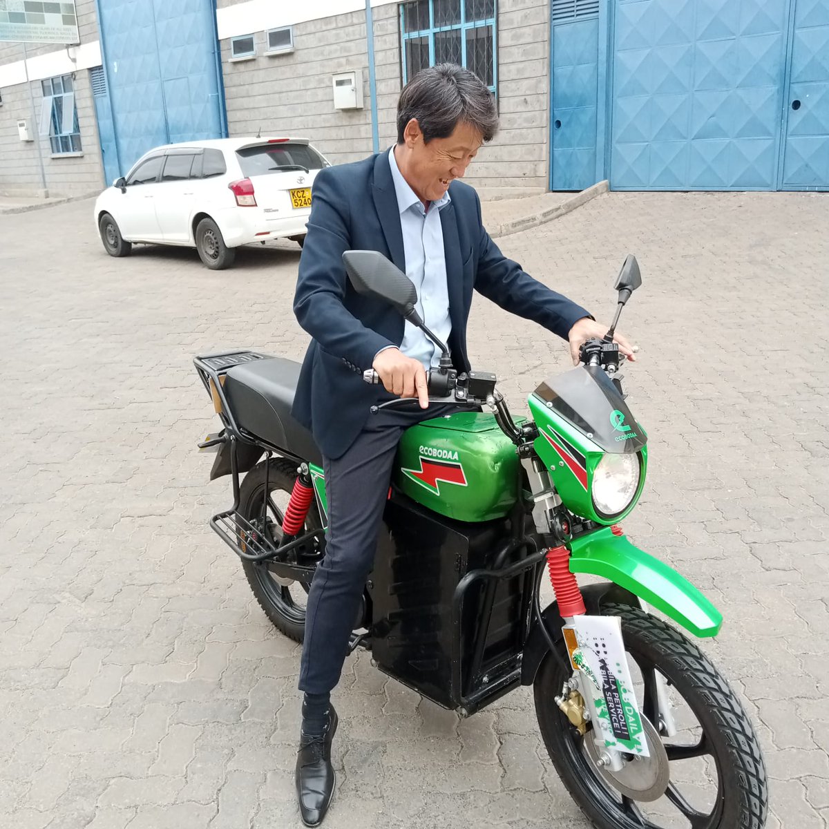 Tupo site with <a href="/CFAOGroup/">CFAO Group</a> MD Toyoki Kuno getting a test ride on our Umeme 3000 electric bodaboda