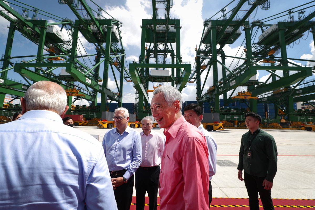 leehsienloong's tweet photo. Very happy to officially launch Tuas Port today! Our decision to press on with it despite the pandemic, sends a strong signal to the world that Singapore is open for business &amp; going full steam ahead. It's a project every Singaporean can be proud of. – LHL https://t.co/TtcE243mTo https://t.co/aU2KJs9KkR