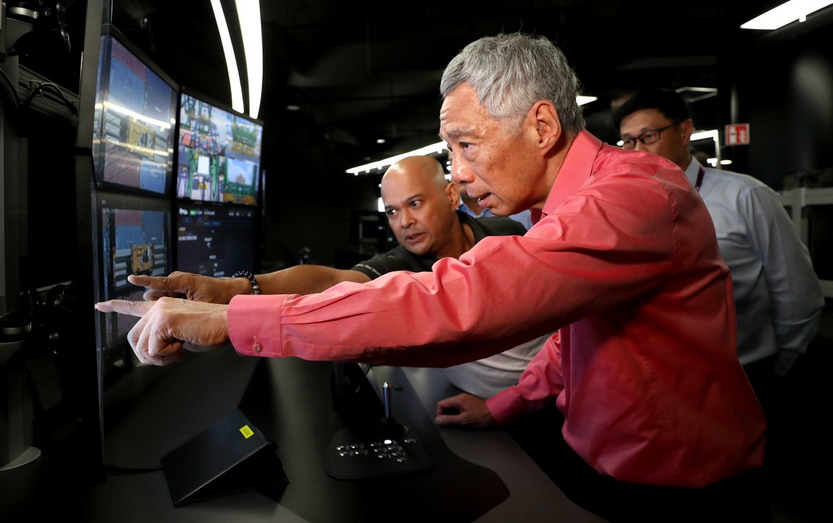 leehsienloong's tweet photo. Very happy to officially launch Tuas Port today! Our decision to press on with it despite the pandemic, sends a strong signal to the world that Singapore is open for business &amp; going full steam ahead. It's a project every Singaporean can be proud of. – LHL https://t.co/TtcE243mTo https://t.co/aU2KJs9KkR