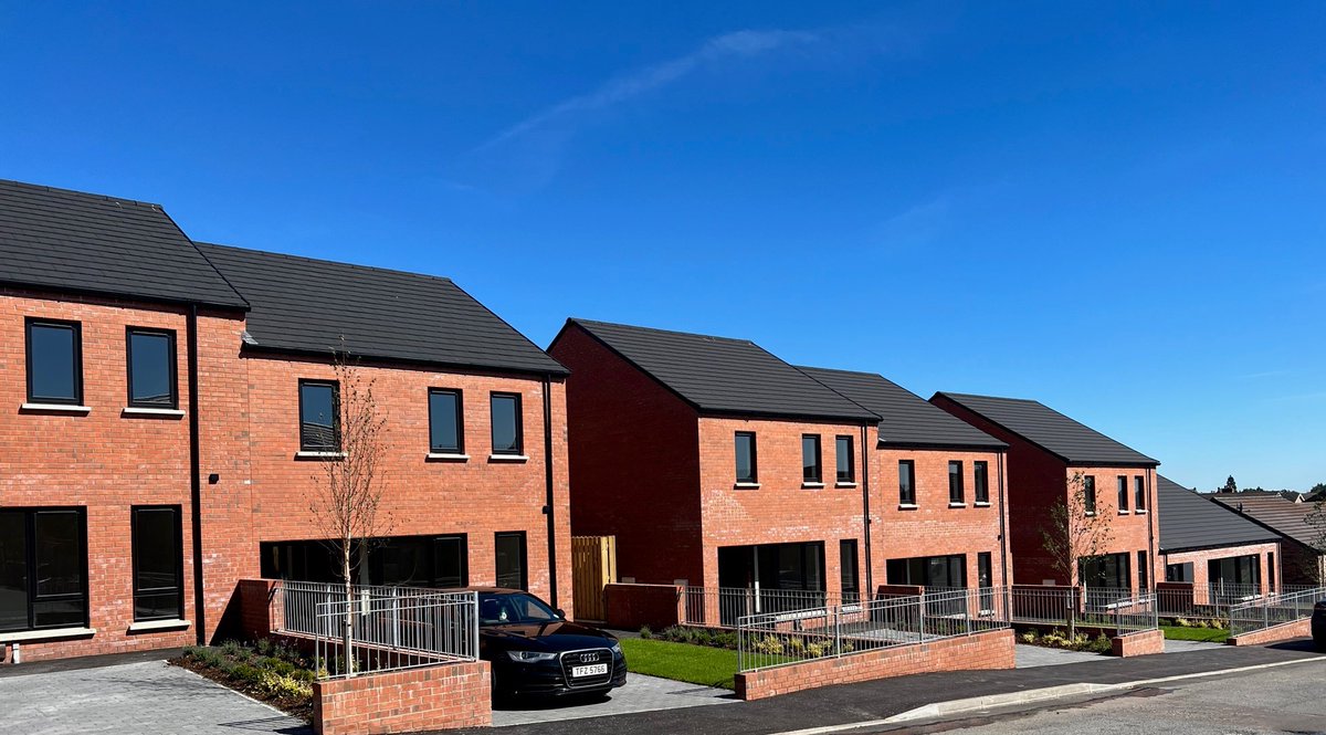 mjmcbrideltd's tweet photo. We recently handed over the Glenbryn Park scheme to @ClanmilHousing. 12 houses were built on a sloped site in North Belfast and included the construction of a Complex Needs bungalow. Thanks to the design team, led by Doherty Architects, for their help in completing this project. https://t.co/E1bLoqk4D8