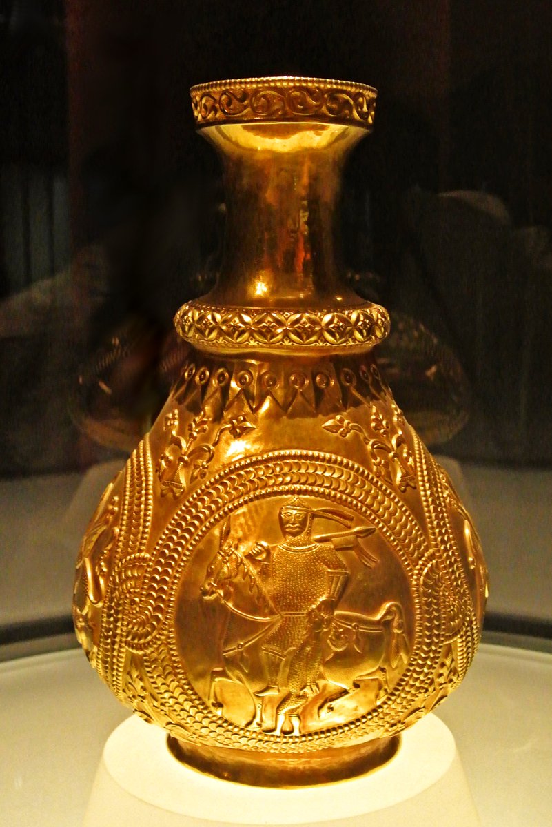 TheArtifactShop's tweet photo. A gold jug from the Treasure of Nagyszentmiklós showing a warrior leading a prisoner by the hair, 7th-9th century https://t.co/VtEDJDw5X4