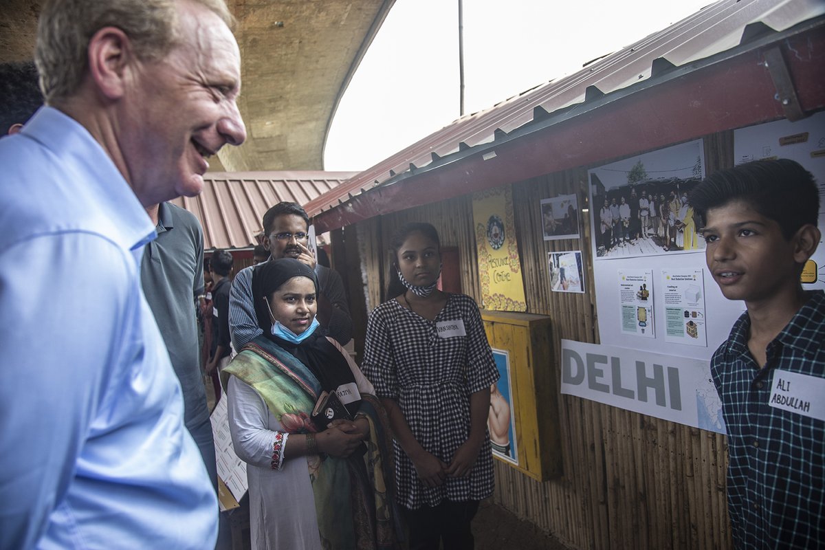 .<a href="/Microsoft/">Microsoft</a> President <a href="/BradSmi/">Brad Smith</a> listens to a Delhi school student talk about disasters, and local innovations to beat the climate crisis. The visit to an informal community was linked to an #AI for Humanitarian Action initiative that <a href="/SeedsIndia/">SEEDS India</a> runs with Microsoft support.