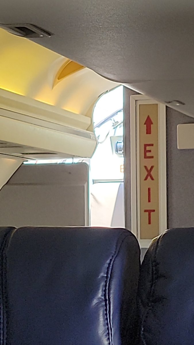 Sitting on a <a href="/ContourAirlines/">Contour Airlines</a> flight at the gate with the door open, but we still can't get off (been 80 min since landing so far). At what point do we inform the police that we're being held hostage?