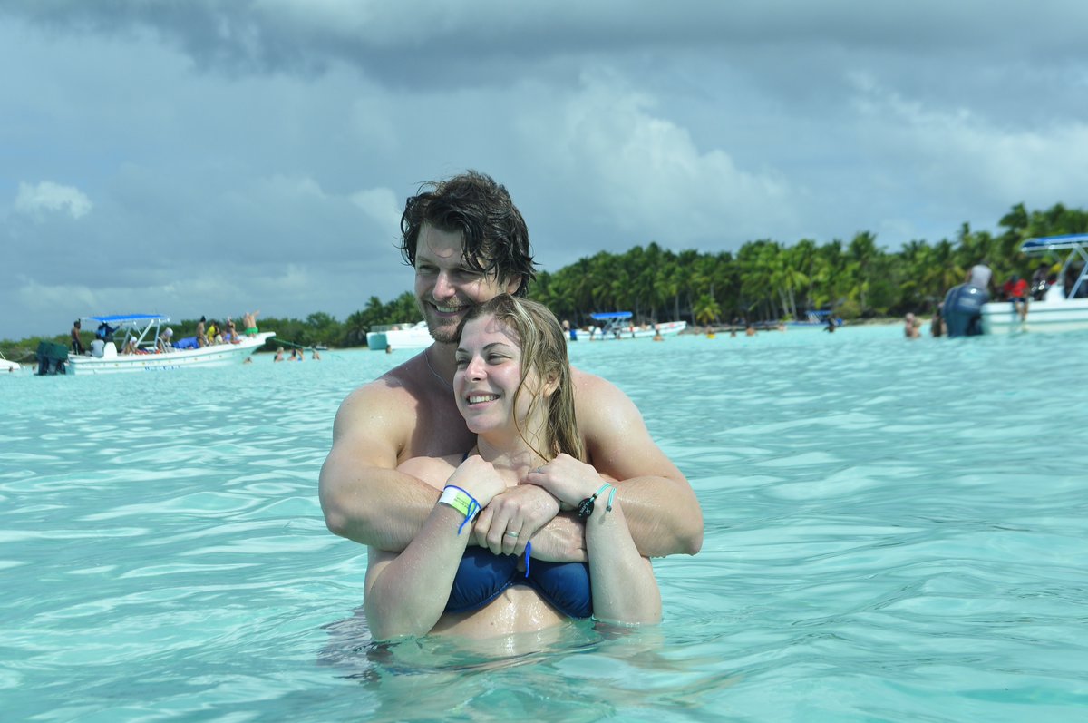 Two people in Punta Canada near Salona Island standing in the natural sea pool.