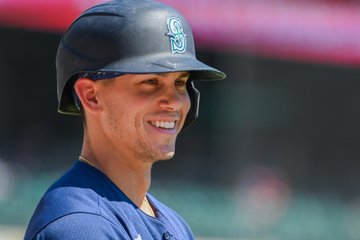 Sam Haggerty smiles with his helmet on.