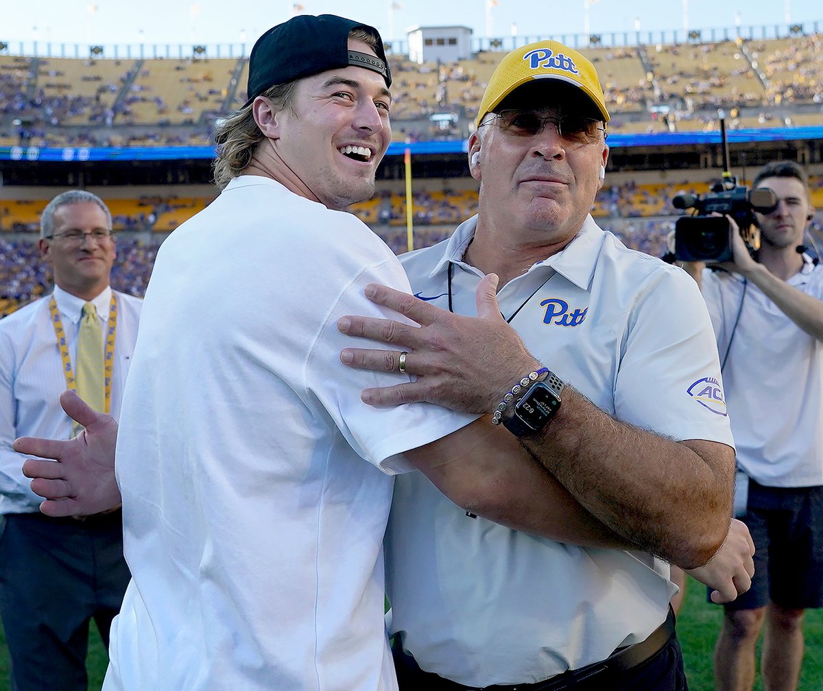 Steelers quarterback Kenny Pickett greets Pitt head coach Pat Narduzzi before the Backyard Brawl Thursday at Acrisure Stadium.