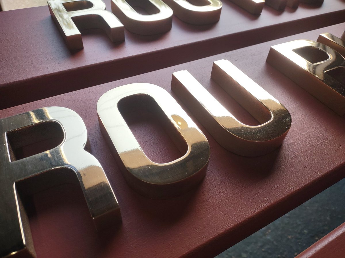 DesignsandSigns's tweet image. More photos of polished bronze letters, pin mount on mahogany. We used barn red stain to protect and color the wood. #sailing #bronze #lettering #signage #NauticalArtwork