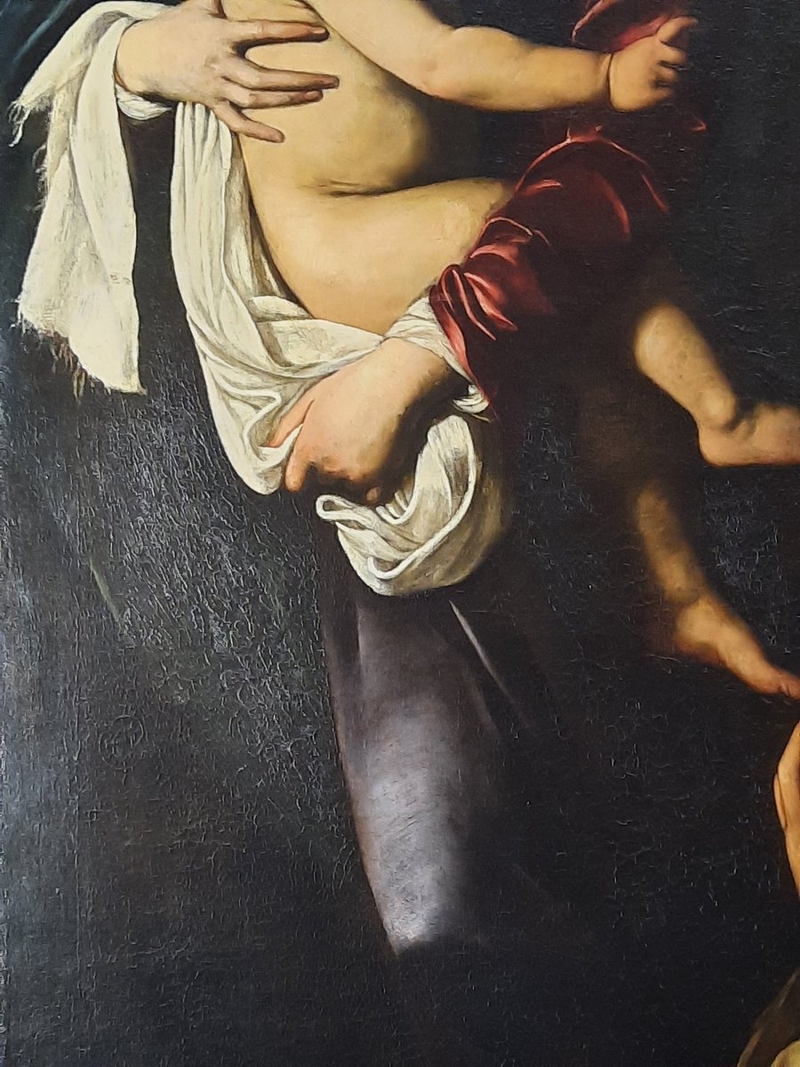 Caravaggio's Madonna of the Pilgrims outside of its setting w conservators on hand to answer questions. Q: why does the blue drape look degraded? He mixed too much oil with his combo of black paint and thin layer of azurite blue creating a structural problem. On view til Sept 3.