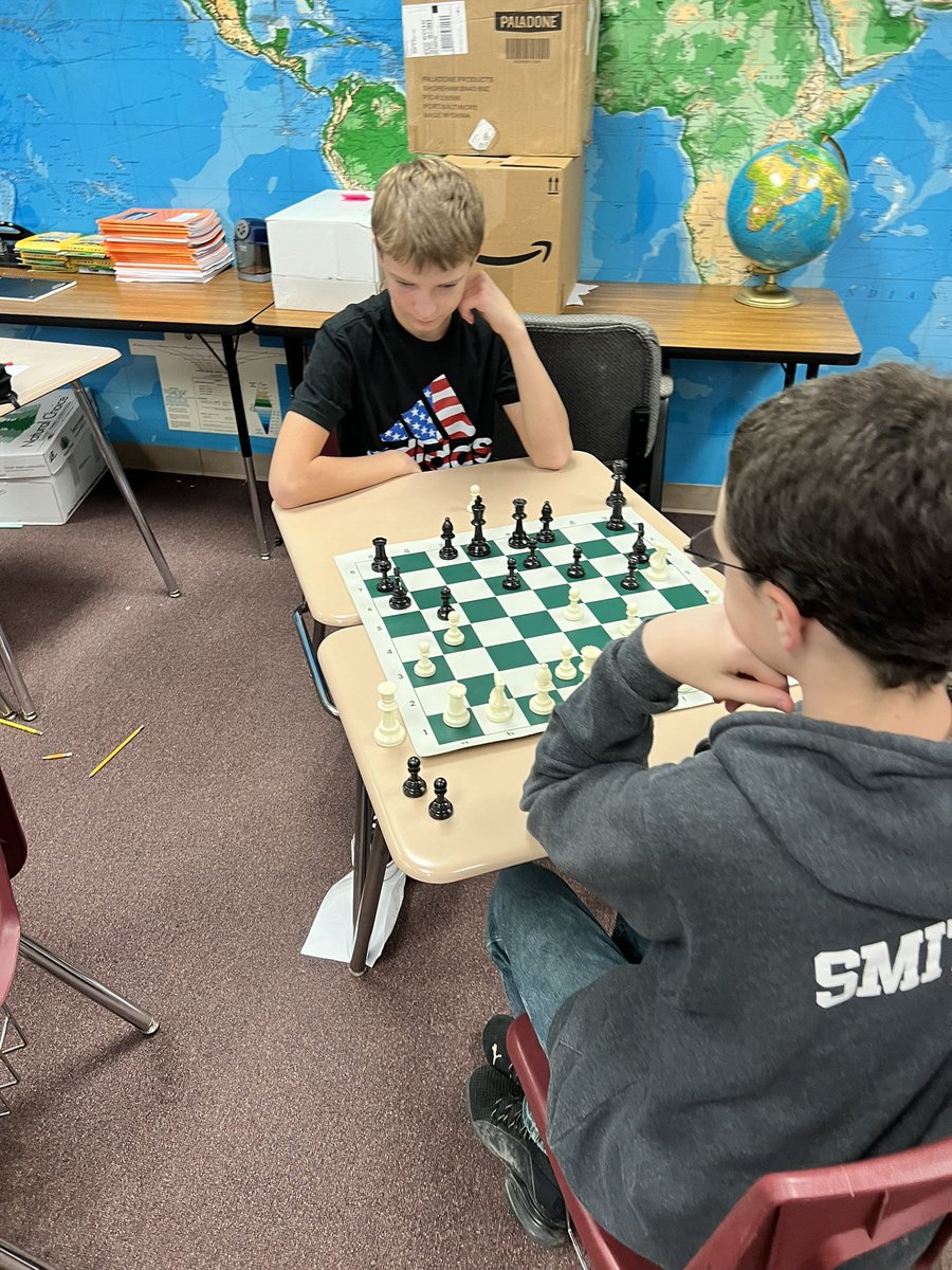 mwoods67037's tweet photo. Social Studies students learning to play chess! The game helps students build essential real world skills, such as planning, critical thinking, geometry/mathematics, and those extremely important social skills. #Rm117 #gamification #BPMS #SocialStudies https://t.co/zyGM9B1lpg